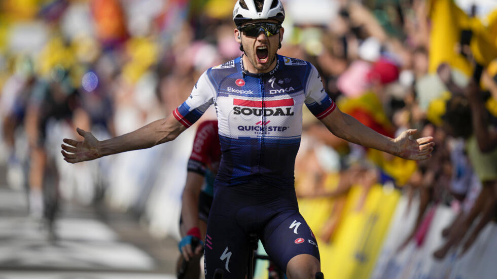 Denmark's Kasper Asgreen crosses the finish line to win the eighteenth stage of the Tour de France cycling race over 185 kilometres from Moutiers to Bourg-en-Bresse in France, July 20, 2023.