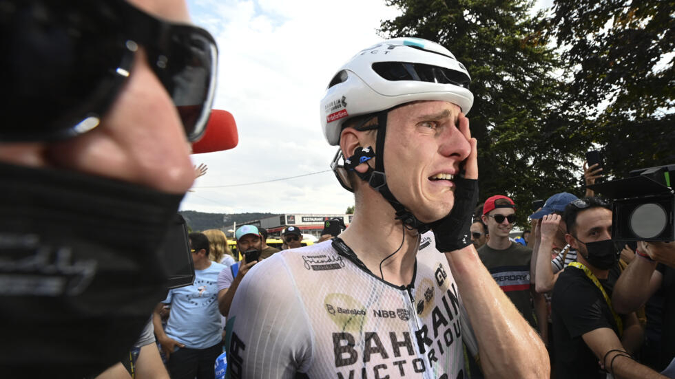 Stage winner Slovenia's Matej Mohoric cries after the nineteenth stage of the Tour de France cycling race over 173 kilometers (107.5 miles) with start in Moirans-en-Montagne and finish in Poligny, France, Friday, July 21, 2023.